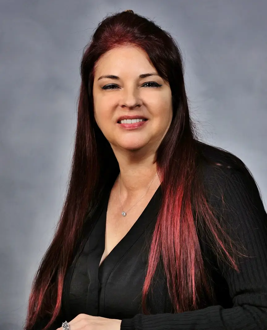 A woman wearing black and smiling